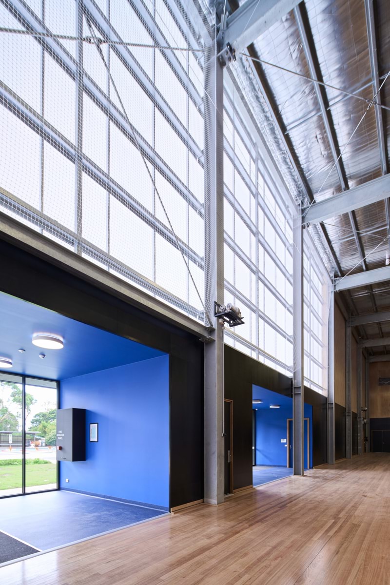 Photo of the gymnasium window and beams