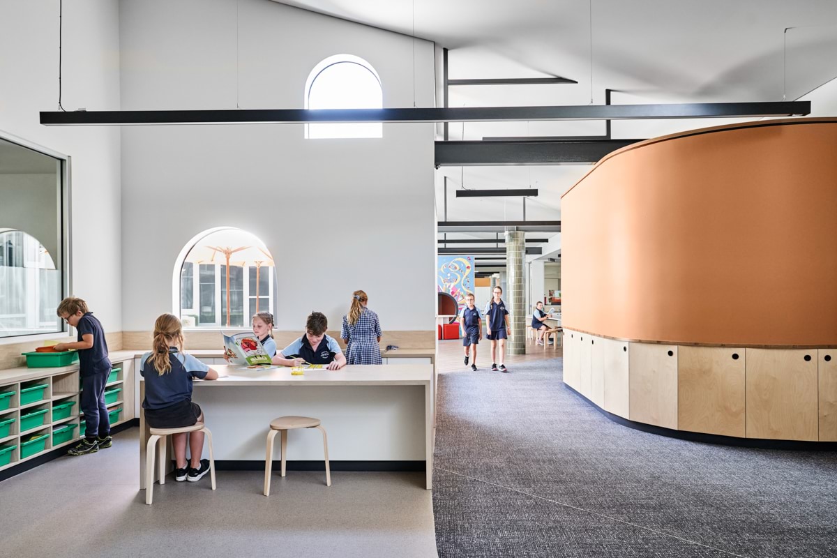 Photo of students in a classroom and the corridor