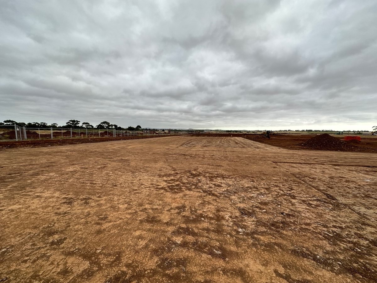 Aintree Secondary School (interim name) - construction photo of site progress in January 2023 - red dirt paddock