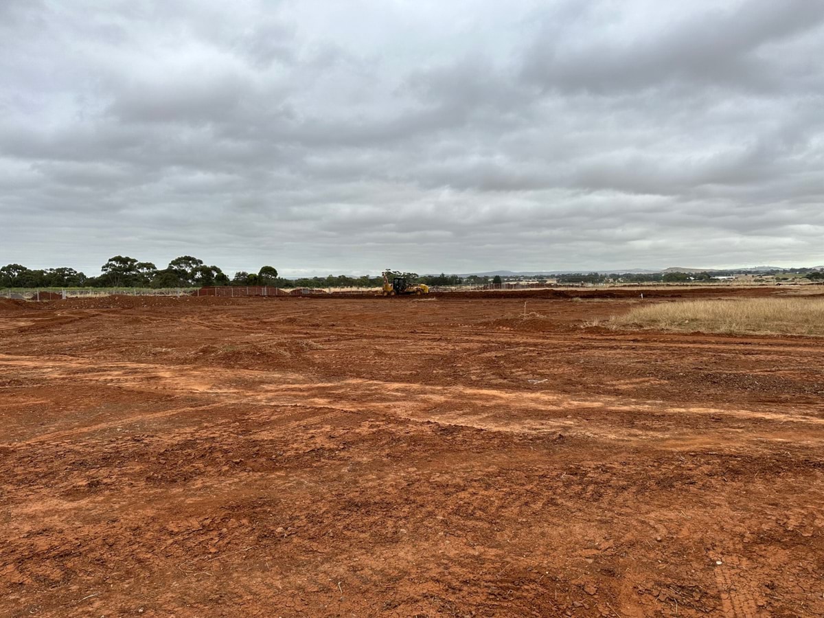 Aintree Specialist School (interim name) - construction photo of site progress in January 2023 - red dirt paddock