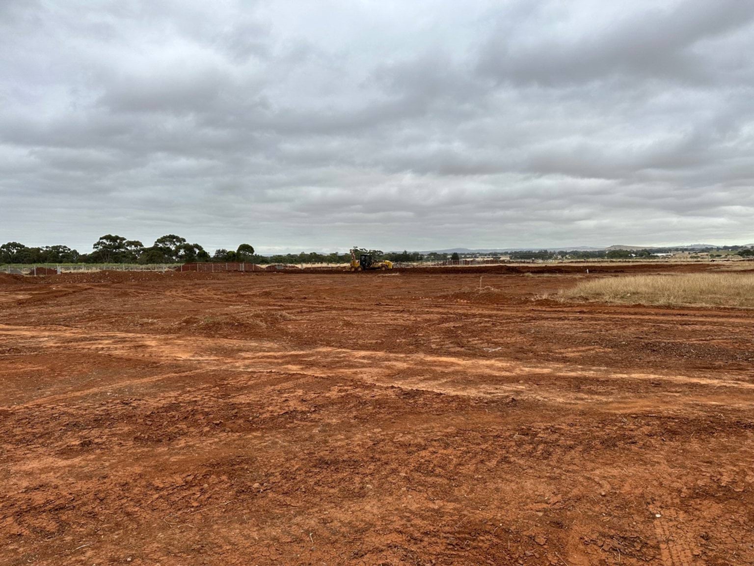 Aintree Specialist School (interim name) - construction photo of site progress in January 2023 - red dirt paddock
