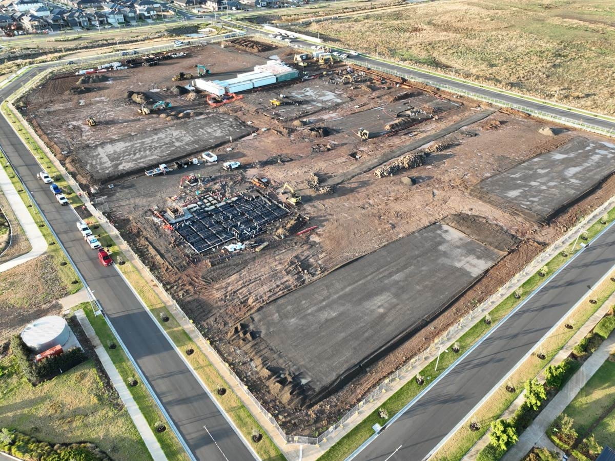 Black Forest East Primary School (interim name) - construction site progress in February 2023 - aerial shot of site showing flattened earth and early construction preparation