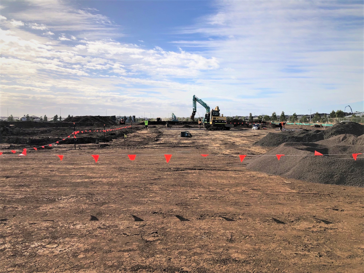 Lollypop Creek Secondary School (interim name) - construction photo of site progress in February 2023 - mechanical digger on construction site