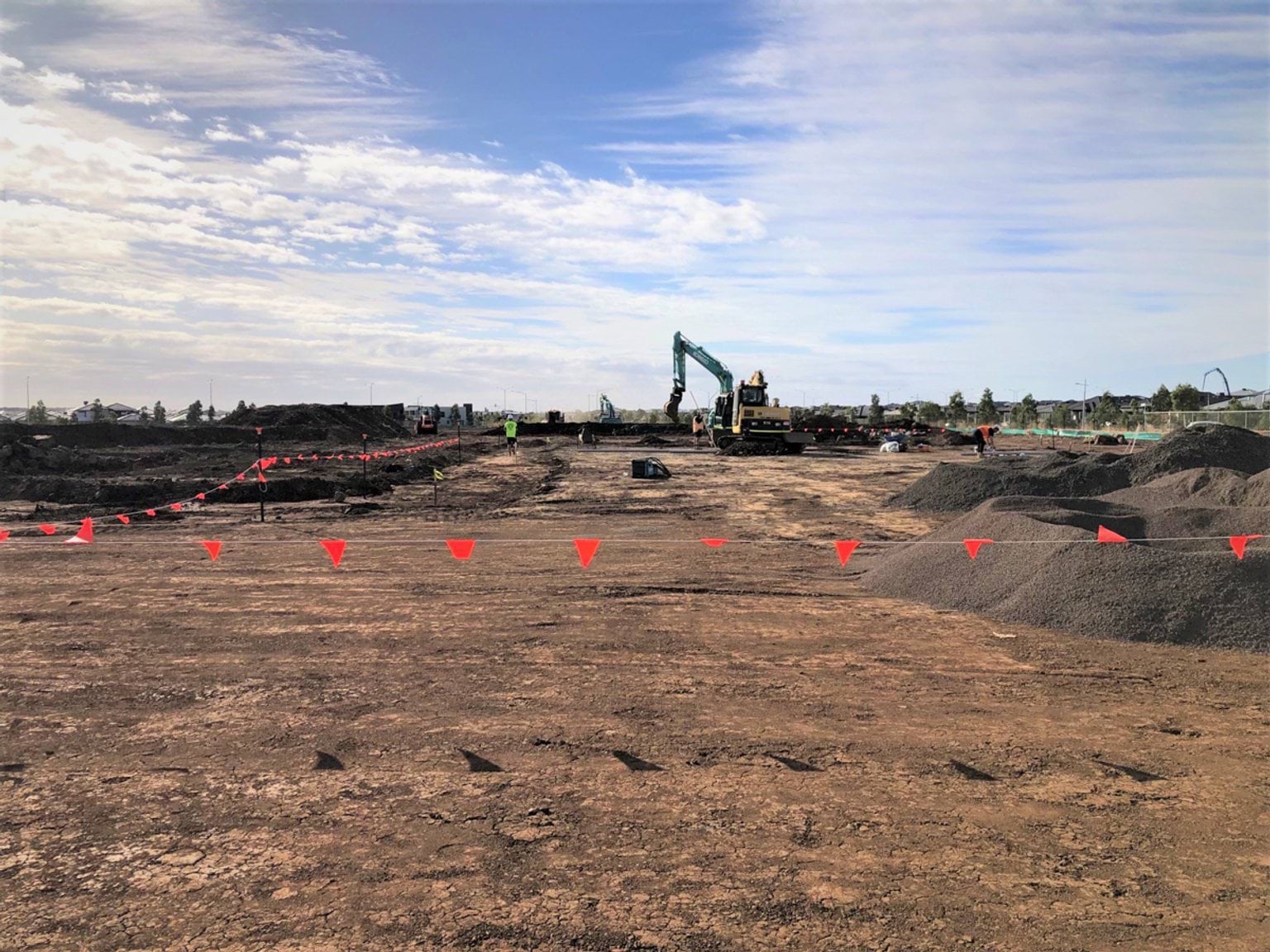 Lollypop Creek Secondary School (interim name) - construction photo of site progress in February 2023 - mechanical digger on construction site