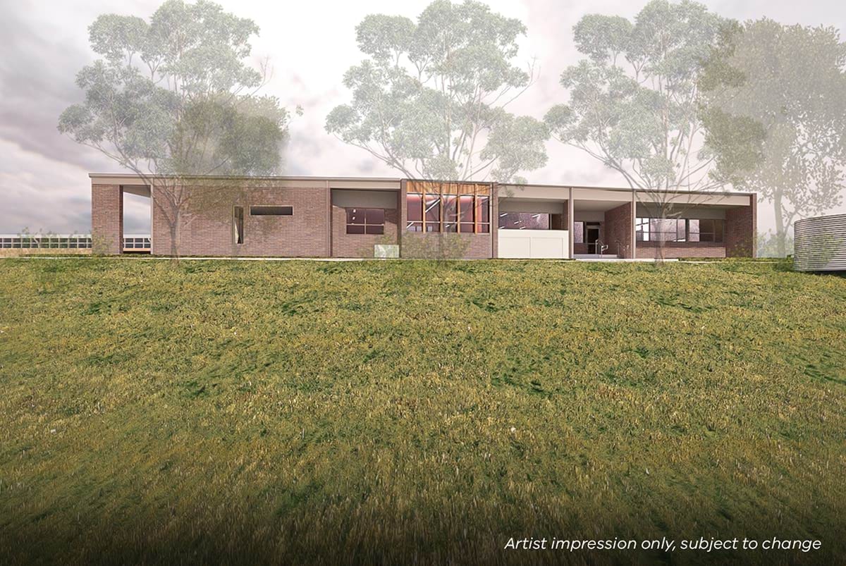 Manchester Primary School - illustrated render showing the outside of a building surrounded by grass and trees