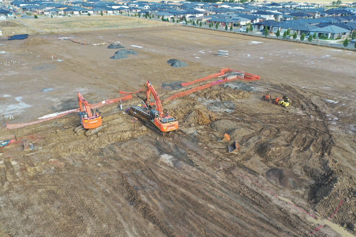 Merrifield South Primary School (interim name) - construction photo of site progress in February 2023 - aerial shot of site showing diggers