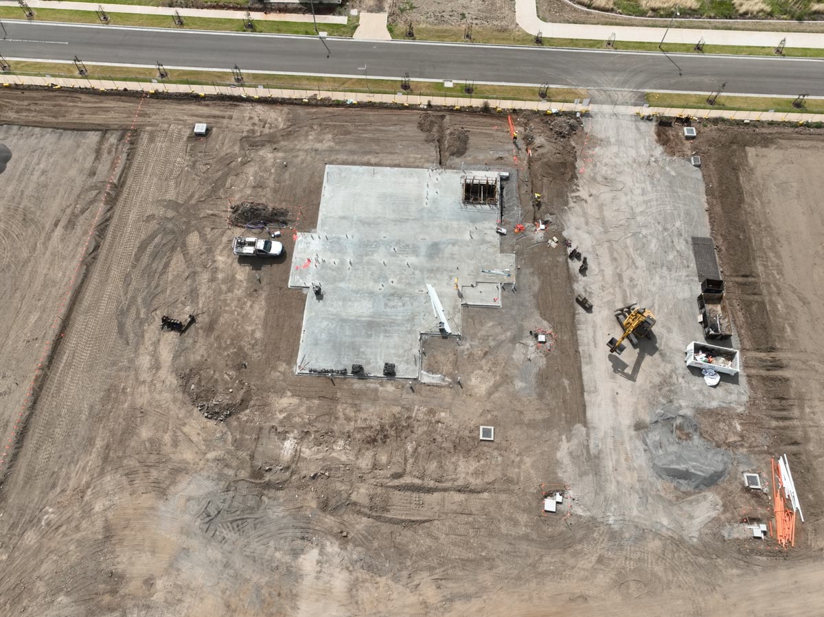 Black Forest East Primary School Kindergarten (interim name) - construction site progress in February 2023 - aerial shot of site showing early concrete foundation work