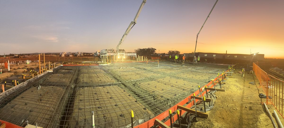 Aintree Secondary School (interim name) - new school - photo of site progress in March 2023, showing cranes working overhead