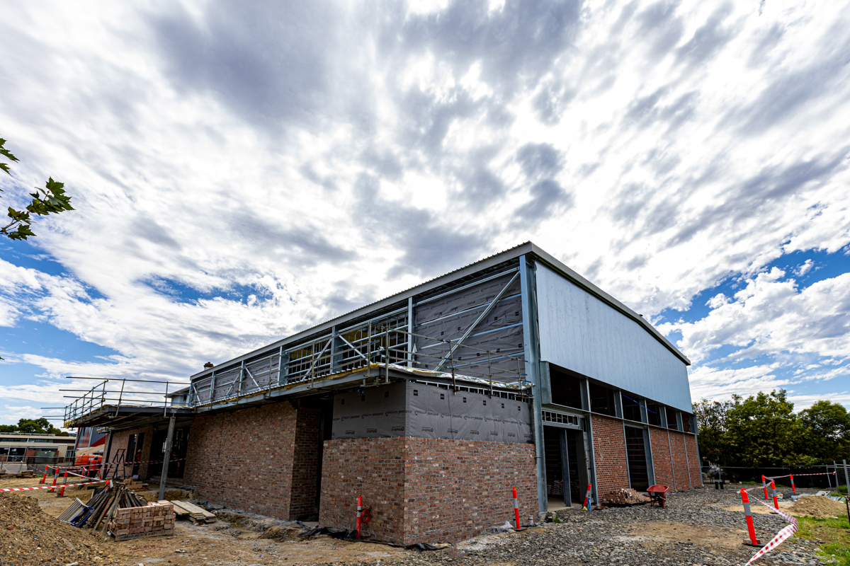 Bell Primary School - photo showing construction progress on a school gym from the outside 