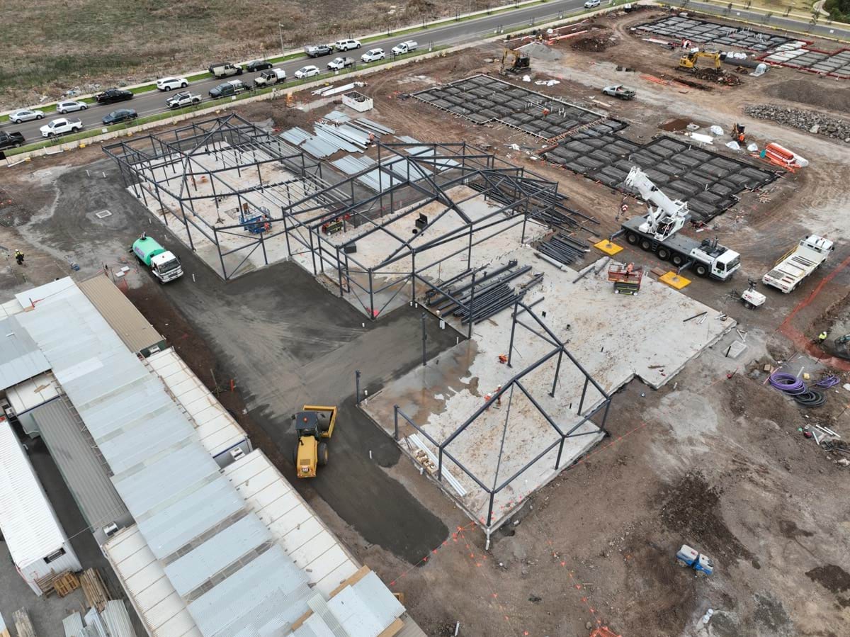 Black Forest East Primary School (interim name) - construction site progress in March 2023 - aerial shot of site showing steel frameworks of school buildings