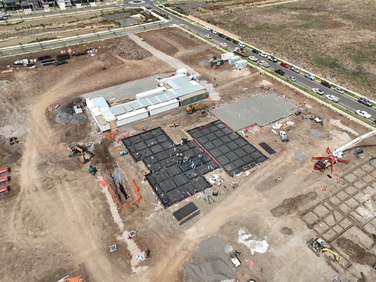 Black Forest East Primary School (interim name) - construction site progress in February 2023 - aerial shot of site showing foundation work and early construction