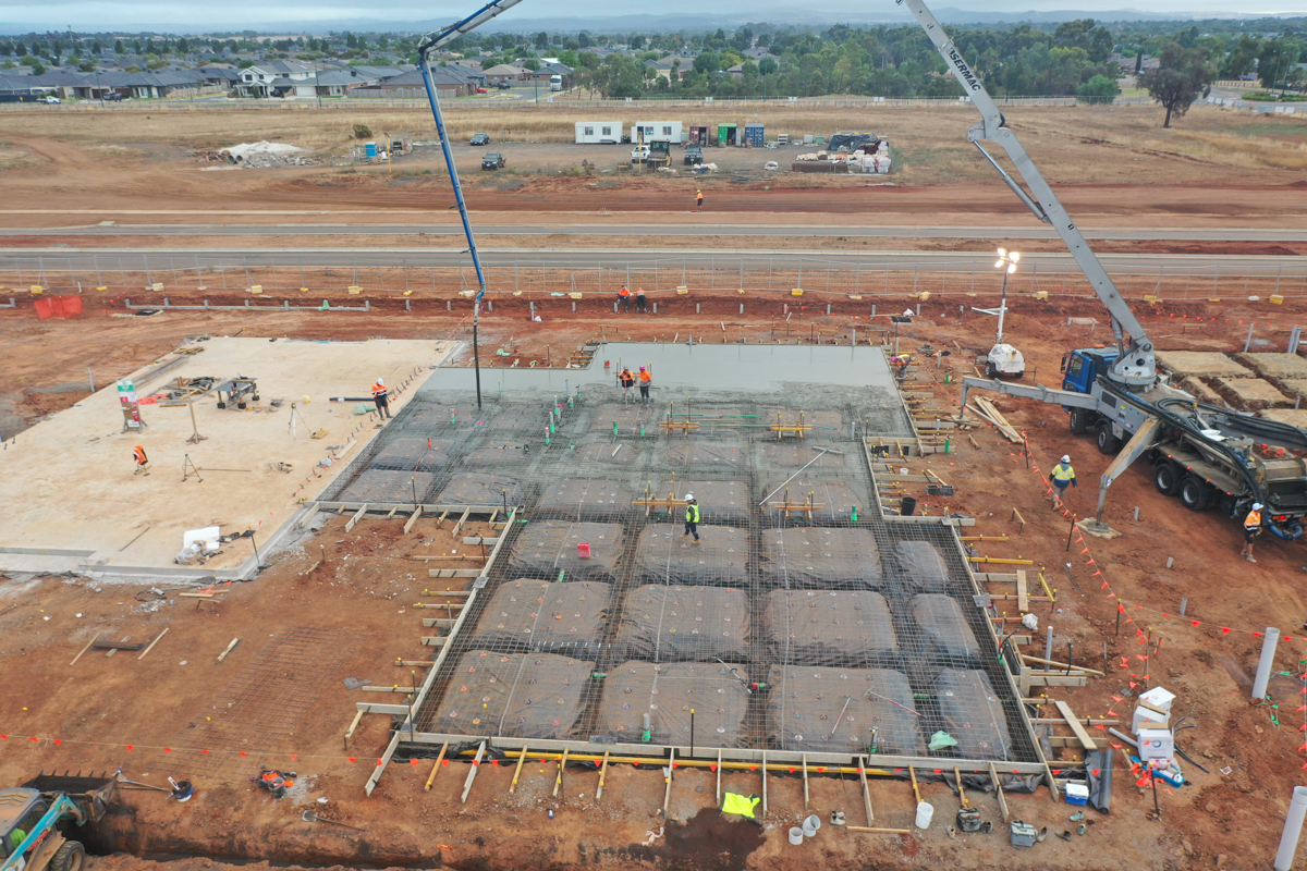 Brookfield Primary School (interim name) - construction photo of site progress in March 2023 showing a crane and foundation works