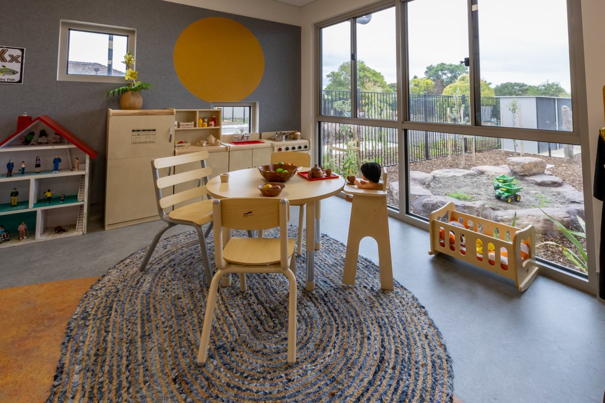 Lalor Primary School Kindergarten - photo of a wooden children's table and chair by a window overlooking an outdoor space