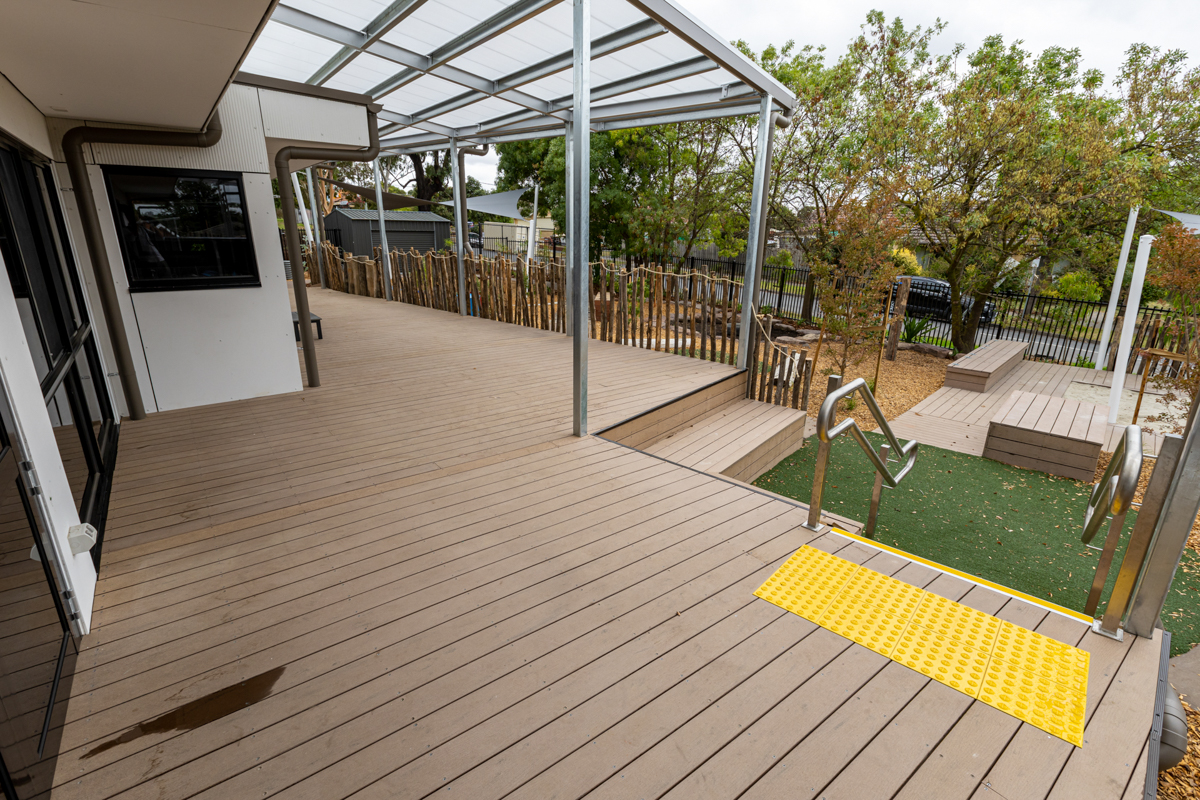 Reservoir East Family Centre - photo of a decking area leading to an outdoor play space