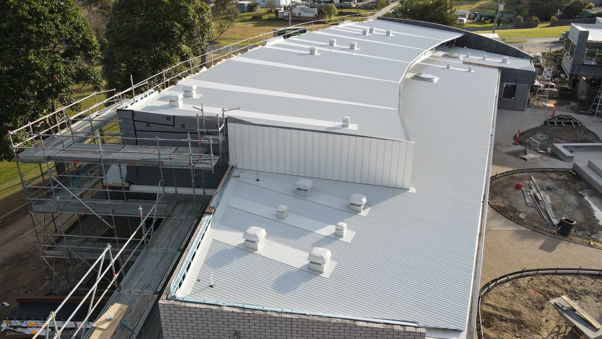 This image shows the roof of a school building under construction.