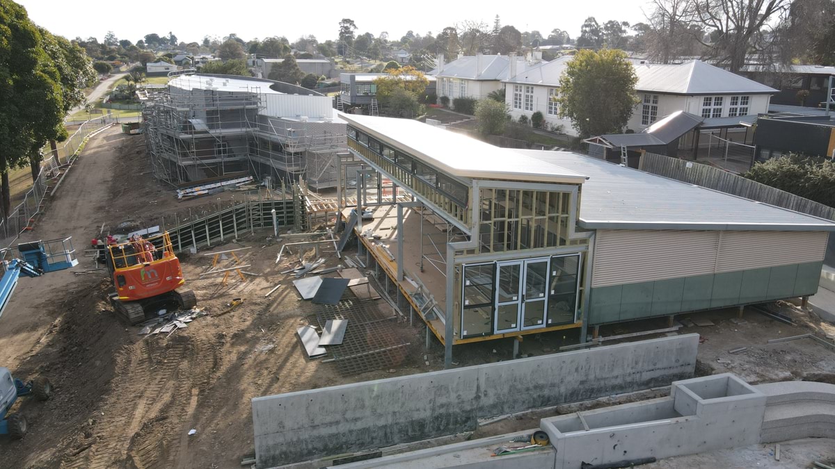 This photo shows the frameworks of a school building under construction.