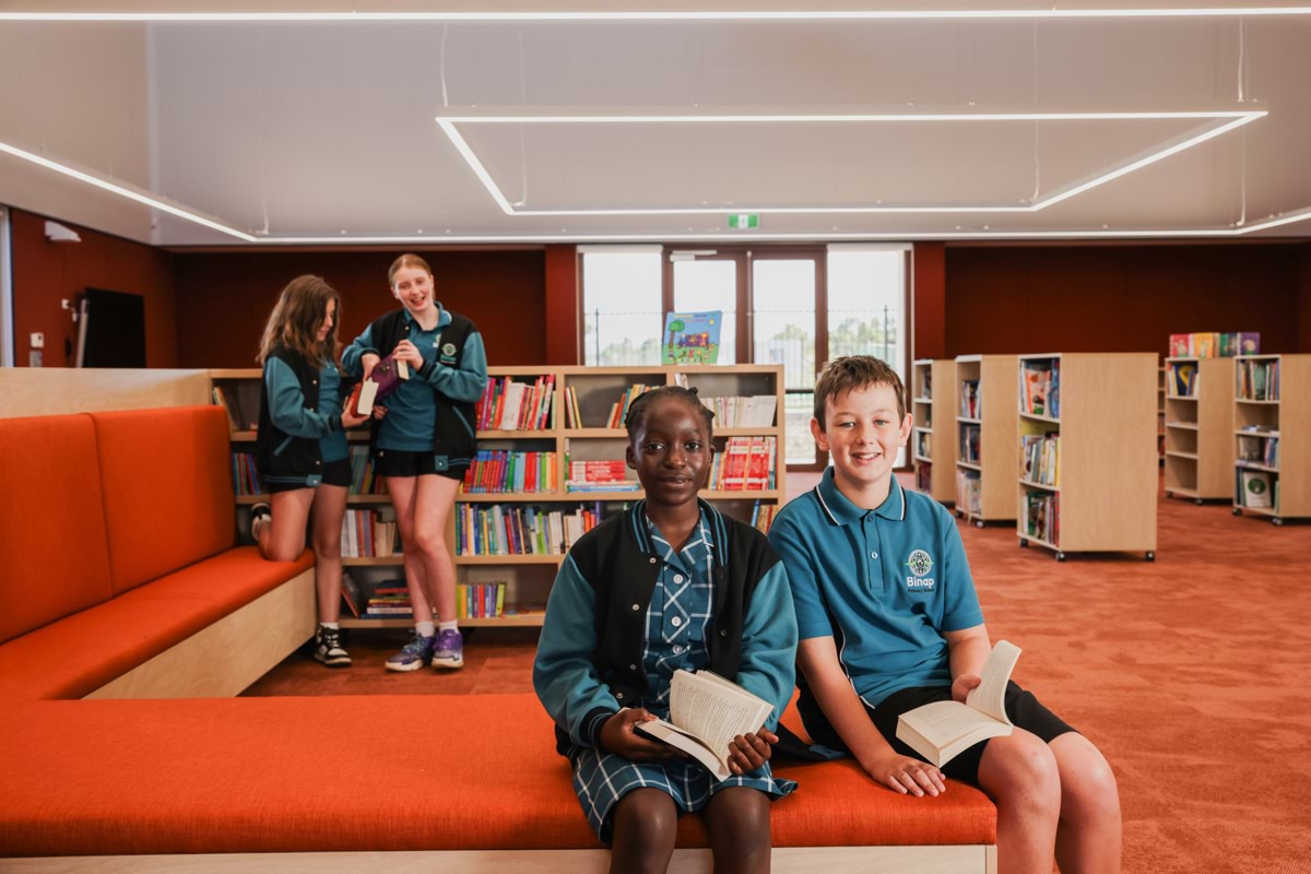 Binap Primary School – official opening, students enjoying the library