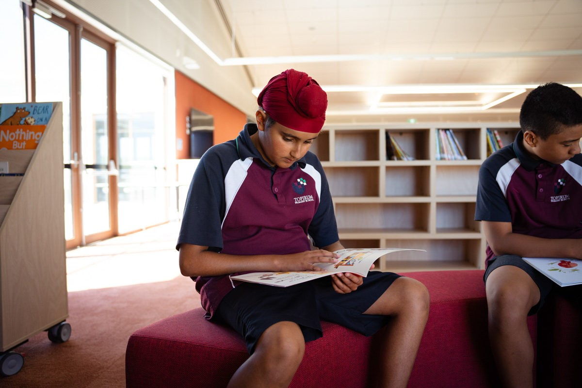 Topirum Primary School – official opening, students spending time in their library