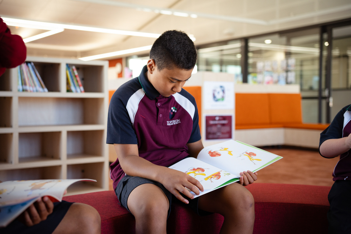 Topirum Primary School – official opening, students spending time in their library