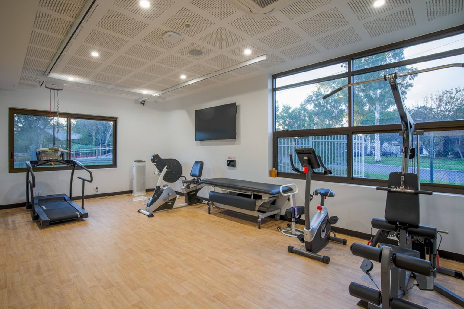 Indoor photo of gym room with exercise equipment