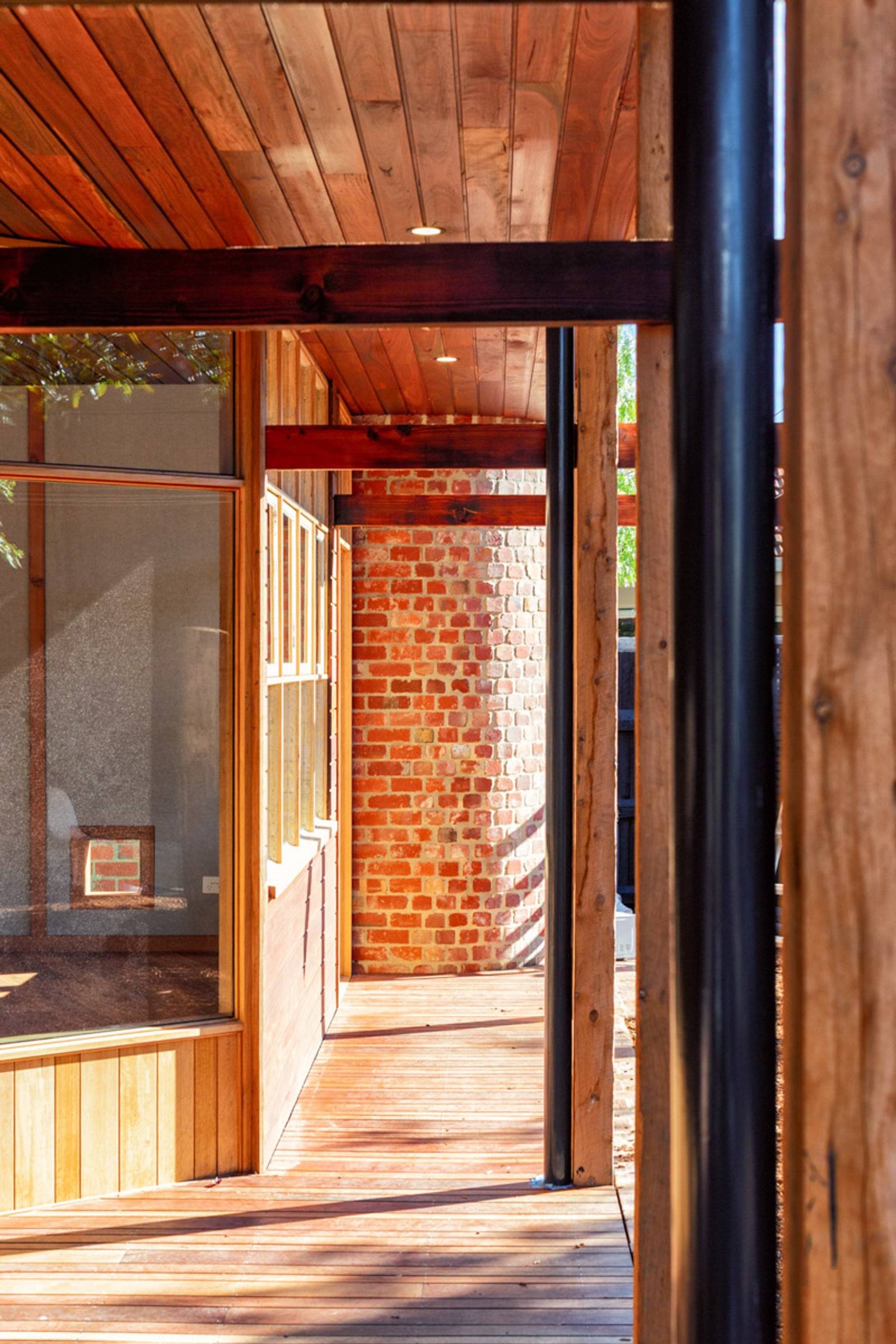 A shot of St Kilda & Balaclava Kindergarten, showing all the different materials of the building: brick, metal, and lots of different shades of brown wood.