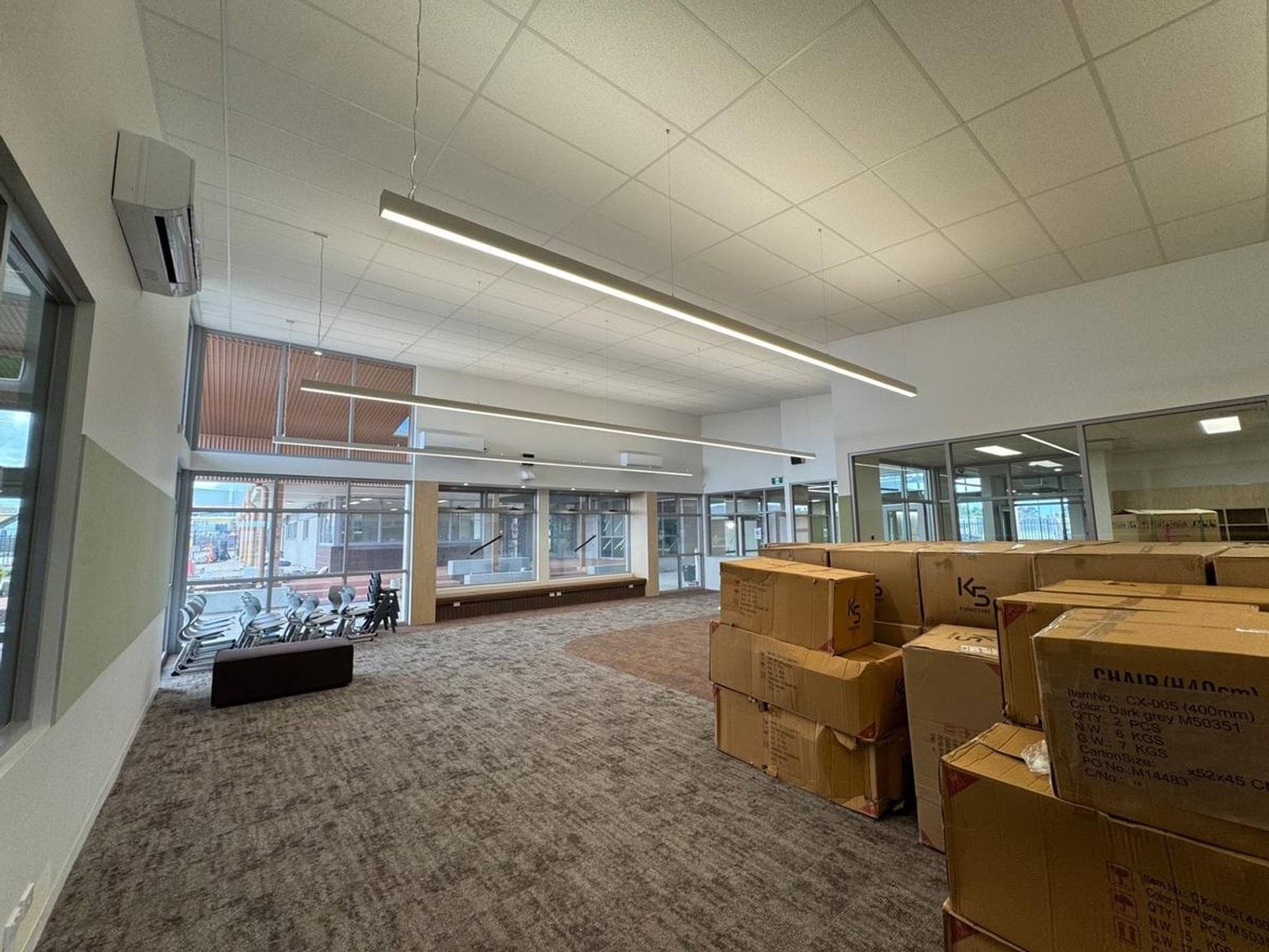 Classroom with boxes in it under construction