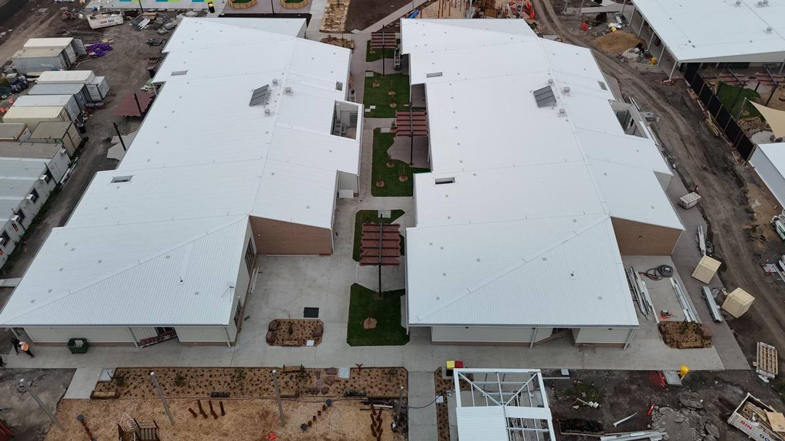 Overhead photo of school buildings - there are two main complexes with a path between them