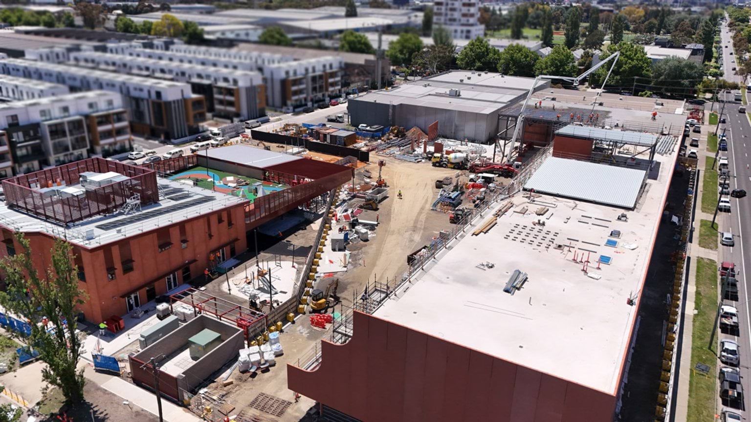 Overhead shot of buildings with trucks and construction equipment