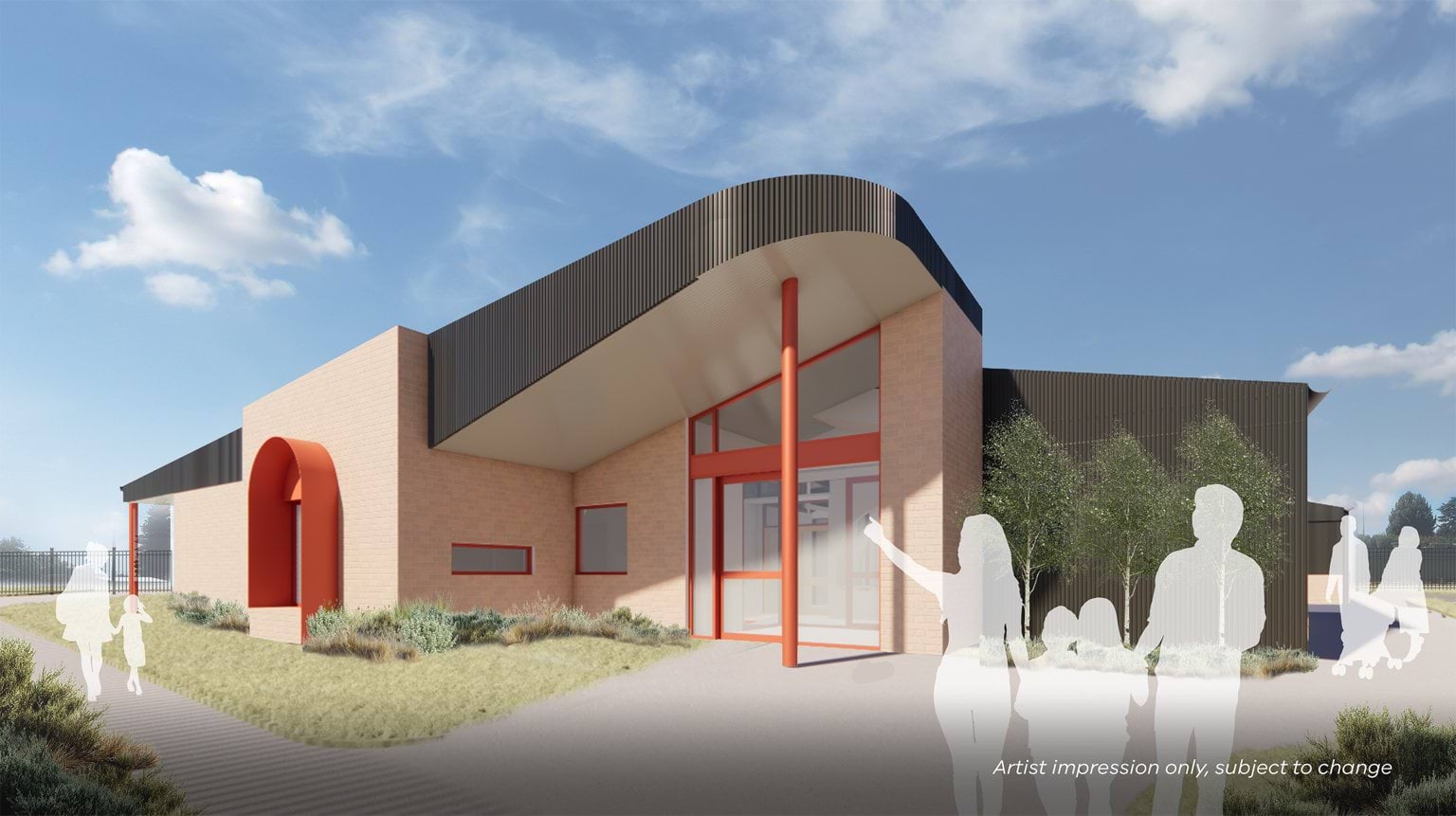 Artist impression of a modern kindergarten building featuring light brick walls, bold red architectural accents, and a curved dark roof. The design includes large windows, a covered entry supported by red columns, and surrounding landscaped garden beds, with silhouettes of families approaching the entrance.