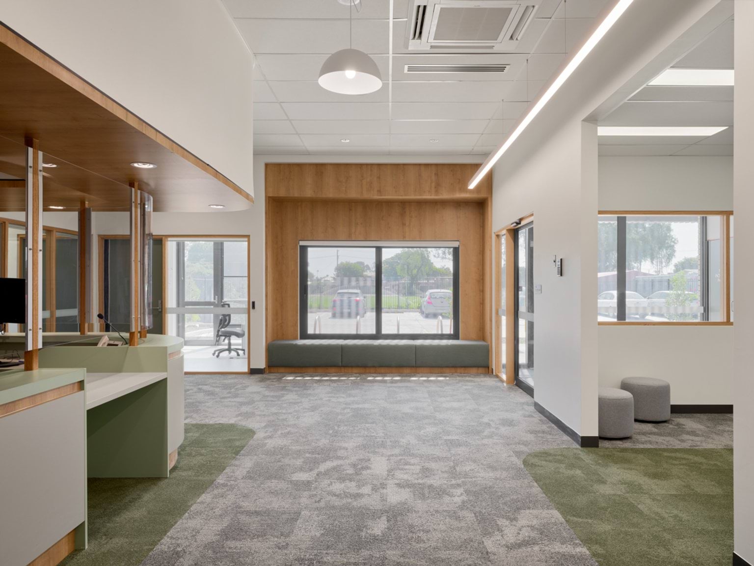 Aerial view of the early learning centre showing the building layout, shade sails, outdoor play zones, and surrounding streets.