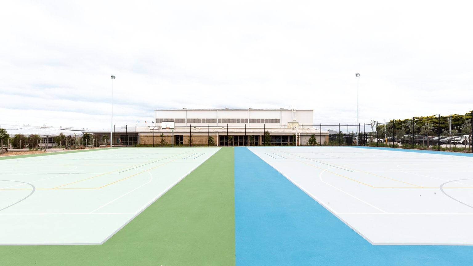 One green and one blue basketball court