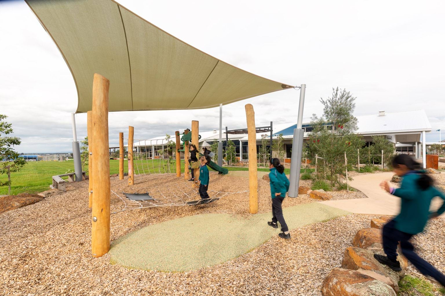 Students playing in covered outdoor play area