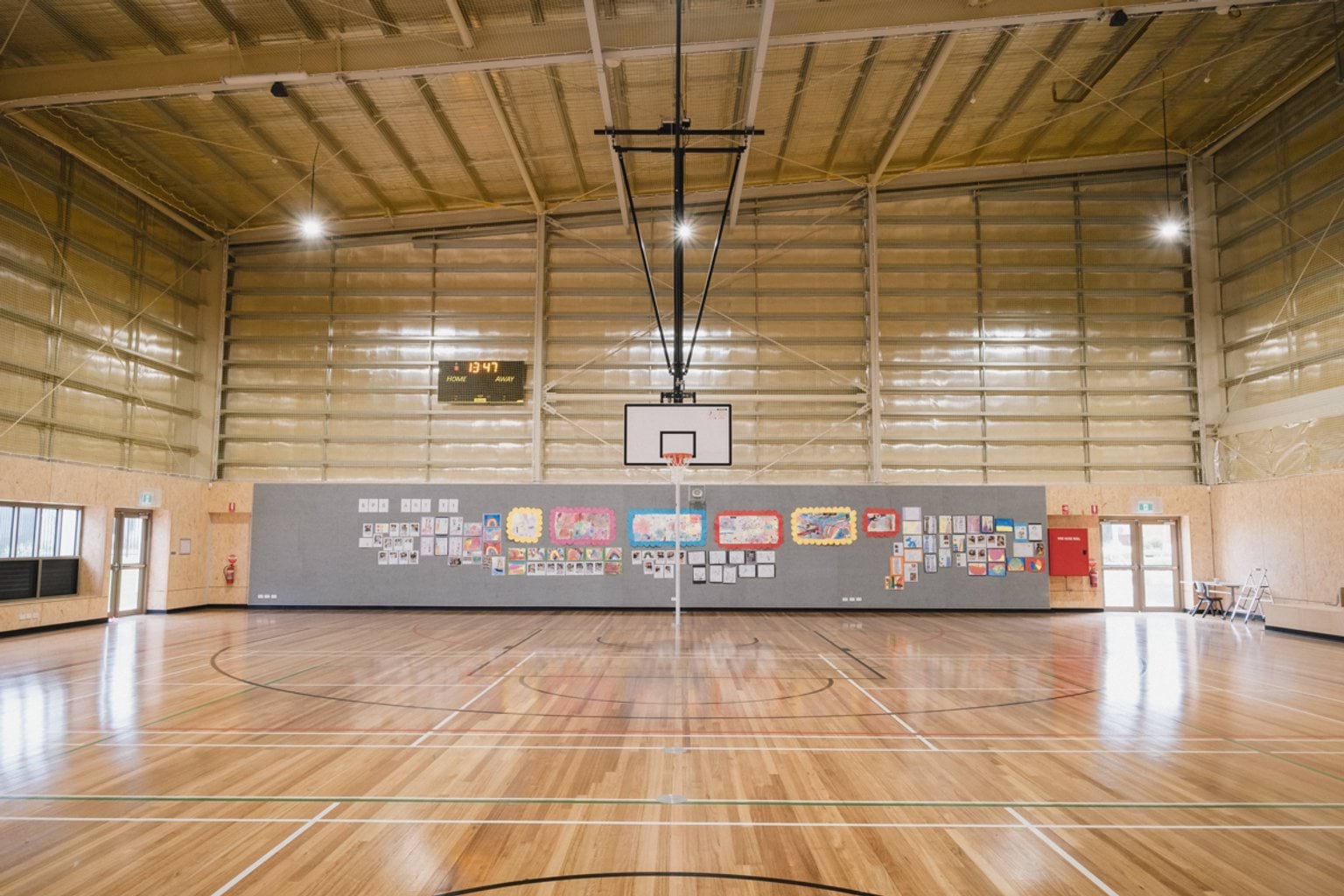 Basketball court from centre court with view of ring.