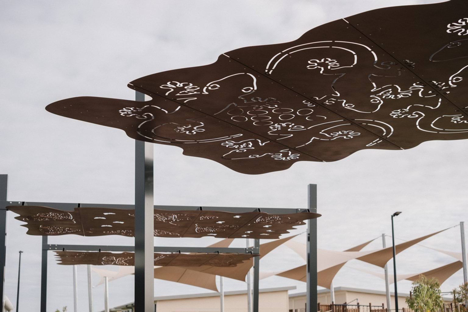Outdoor metal shelter with cut out of first nations artwork