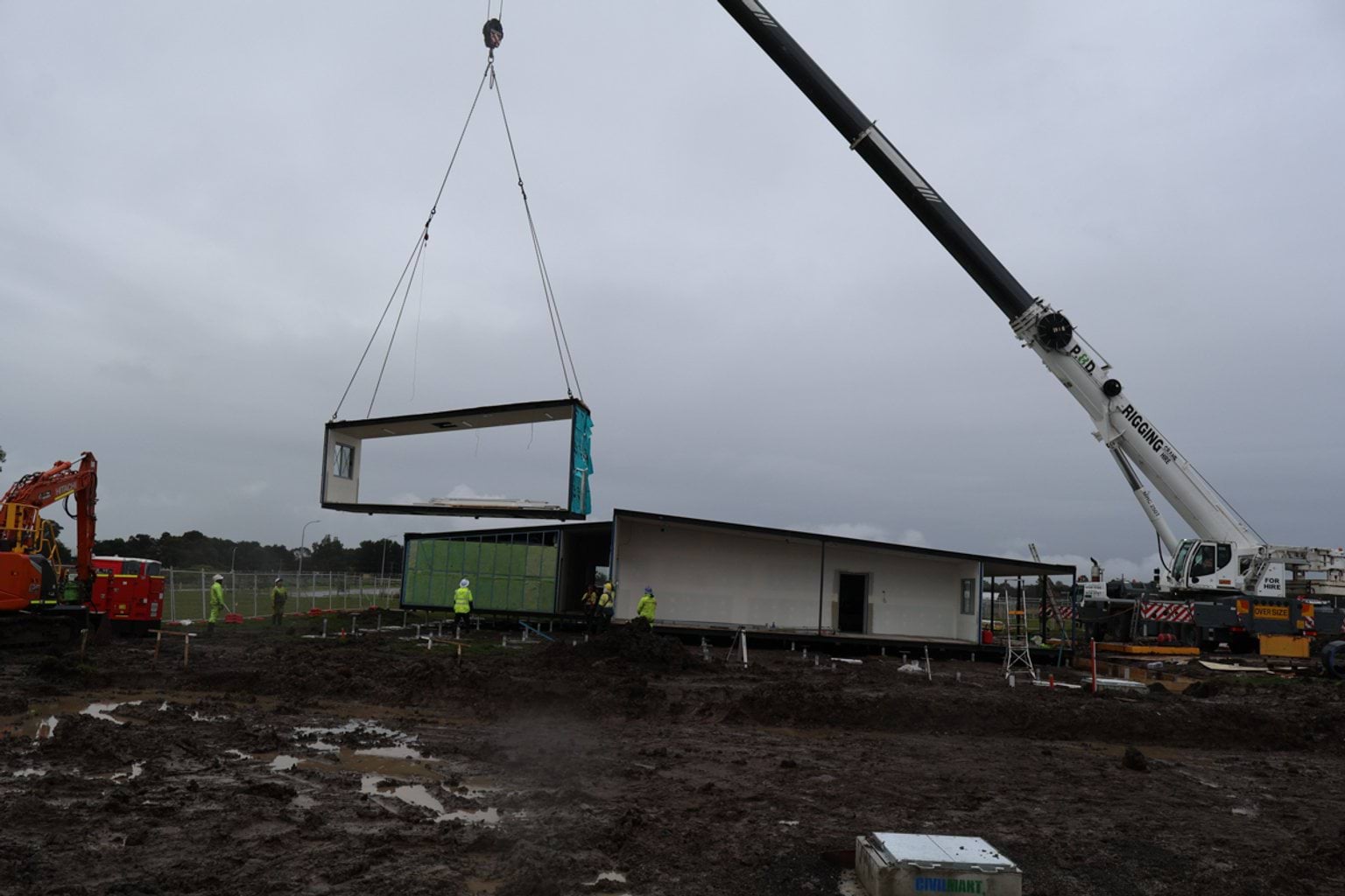 Image of crane installing modular kindergarten building