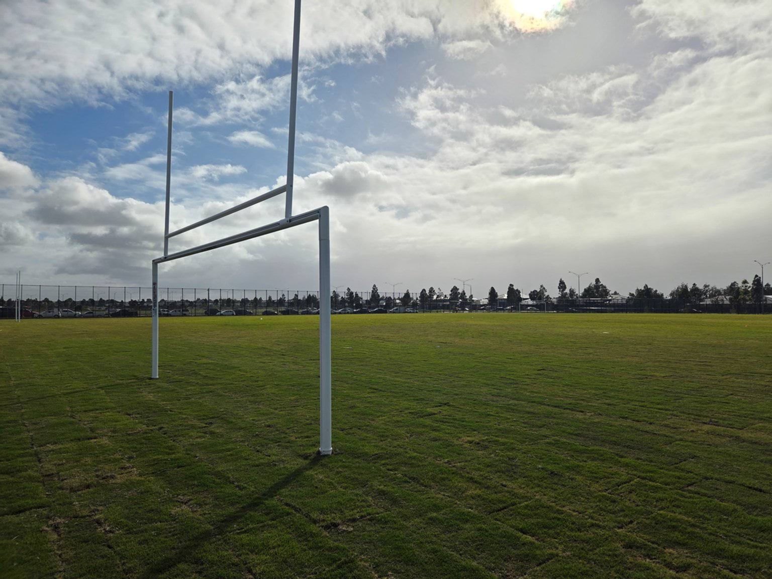 Newly laid rugby field with posts